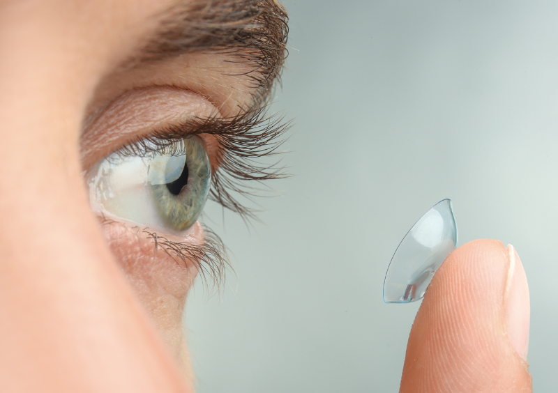 Close-up of a contact lens on a fingertip