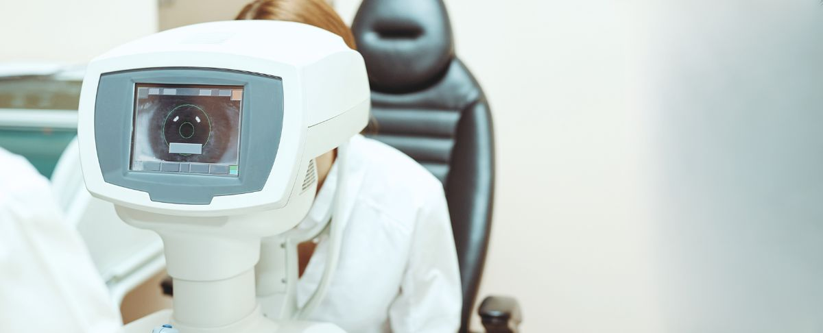 Eye care professional examining a patient
